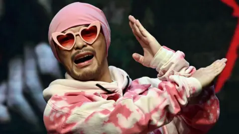 Investigation into Influencer's Death Leads to Arrest of Controversial Rapper Namewee