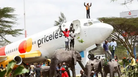 Mourning the Legacy: Thousands Gather at Kenyan Airport for Raila Odinga's Return