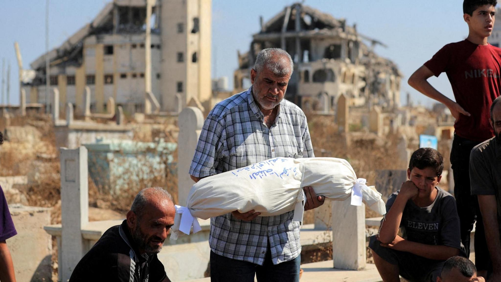 12 Palestinians Killed in Gaza Strikes; Humanitarian Crisis Intensifies Amid Conflict
