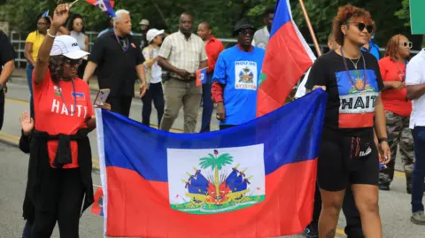 Federal Judge Halts Deportation Plans for Haitian Migrants Amid Legal Battles