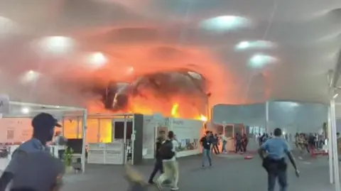 Emergency Evacuation at COP30 as Fire Erupts at Climate Talks