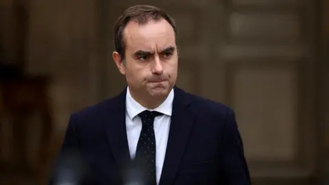 French Prime Minister Secures Key Budget Approval Amid Political Turmoil